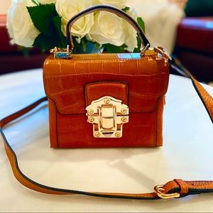 Small cross body leather bag with gold details. NEW